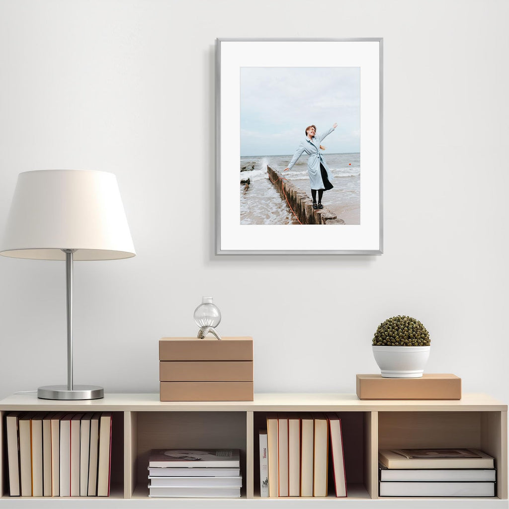 Frametory, 6x8 Aluminum Picture Frame - 6 x 8 Black Frame with Removable Mat for 5 x 7 Photo - 6 by 8 Durable Metal Frame with Real Glass - Sawtooth Hanger for Easy Wall Display - 1 Pack