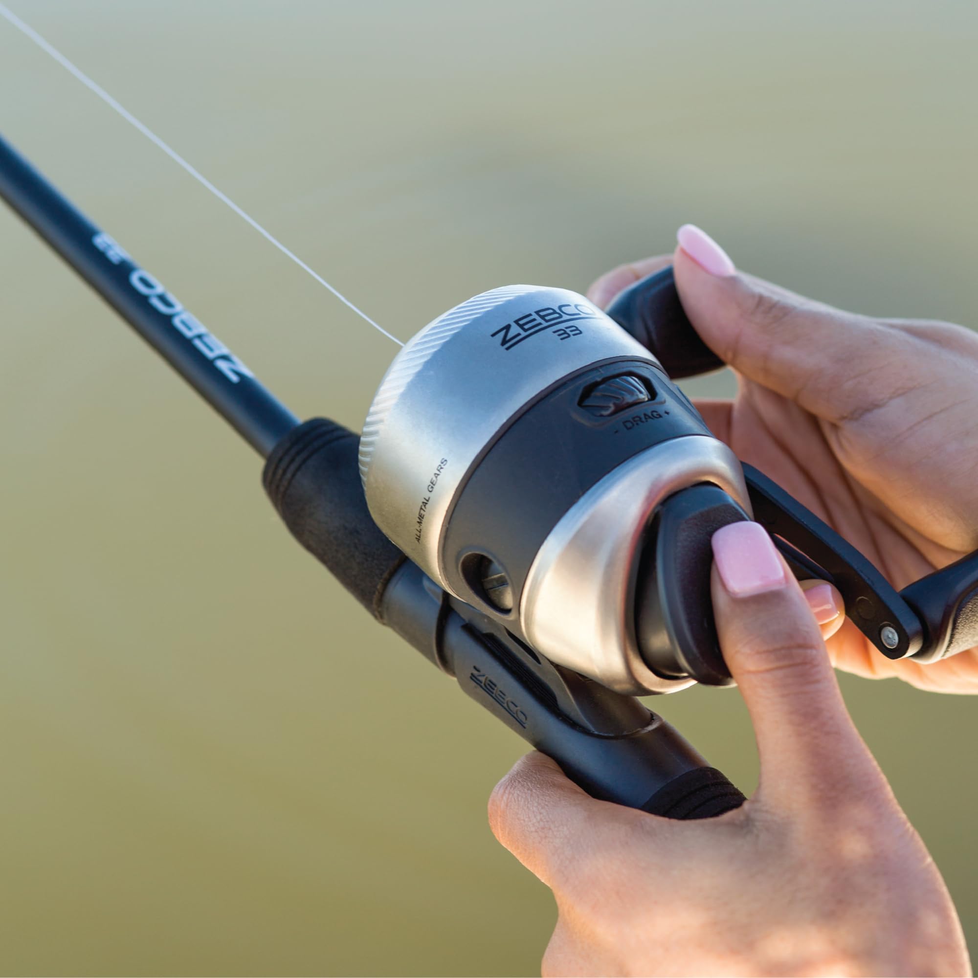 Zebco 33 Spincast Fishing Reel, Changeable Right or Left-Hand Retrieve, Built-in Bite Alert, All-Metal Gears, Pre-Spooled with Zebco Cajun Line