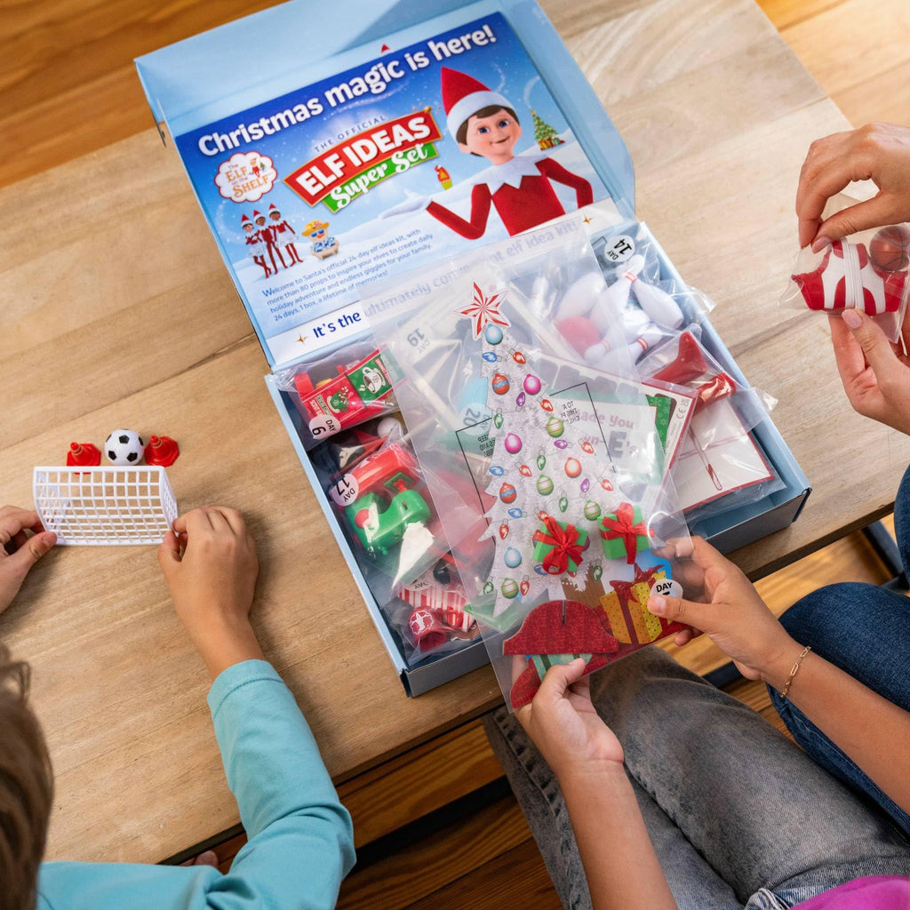 The Elf on the Shelf 24-Day Super Set Official The Elf on the Shelf Ideas for 24 Days of Elf Magic - 80+ Props, MagiFreez Standing Pants and Calendar - for Ages 3 Years and Up Scout Elf Not Included